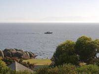 Sail boat passing the flat